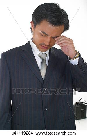 Picture - Businessman with a headache . Fotosearch