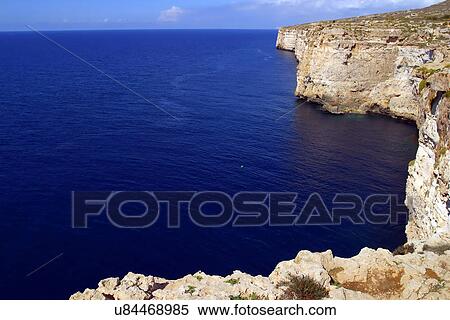 Cliff along a shoreline  View Large Photo Image Stock Photography - Cliff along a shoreline . Fotosearch