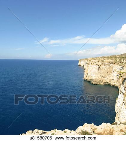 Stock Photography - Cliff by water. Fotosearch