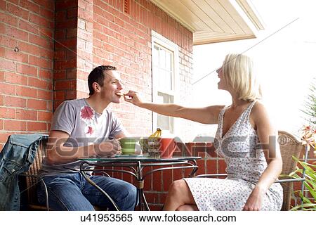Couple eating breakfast View Large Photo Image Stock Photography - Couple eating breakfast . Fotosearch