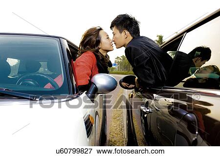 Stock Photo - Couple kissing . Fotosearch