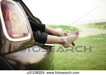 Couple laying in the back of car View Large Photo Image Picture - Couple laying in the back of car . Fotosearch
