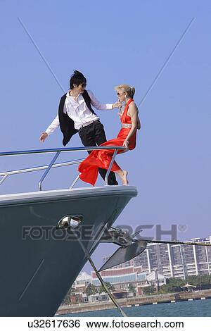 Couple on a yacht View Large Photo Image Stock Photograph - Couple on a yacht . Fotosearch