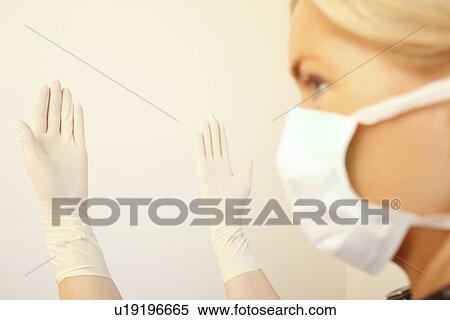 Doctor with mask and rubber gloves View Large Photo Image Stock Photography - Doctor with mask and rubber gloves . Fotosearch