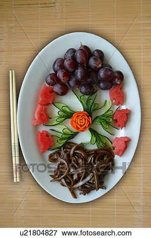 Stock Photo - Grapes and chop sticks . Fotosearch