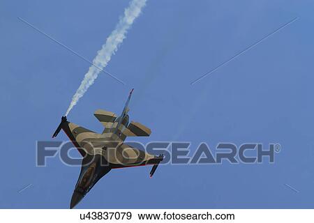 Jet flying down View Large Photo Image Stock Photo - Jet flying down . Fotosearch