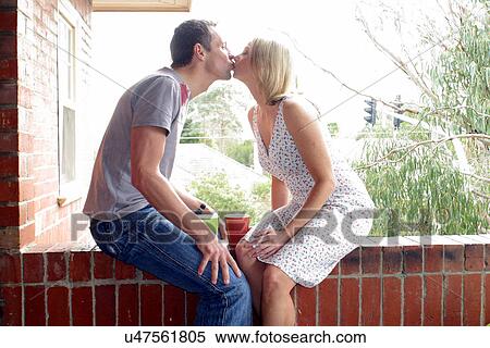 Stock Photography - Kissing couple. Fotosearch