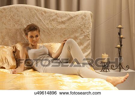 Stock Photograph - Laying in bed. Fotosearch