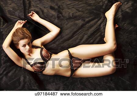 Laying model View Large Photo Image Stock Photo - Laying model . Fotosearch