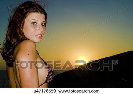 Looking over her shoulder View Large Photo Image Stock Photo - Looking over her shoulder . Fotosearch