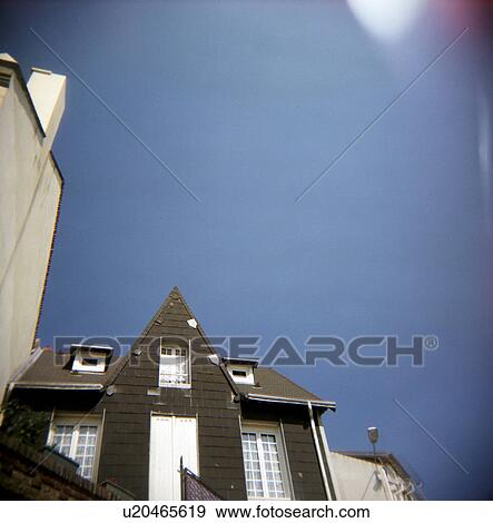 Stock Photo - Low angle view of a home. Fotosearch
