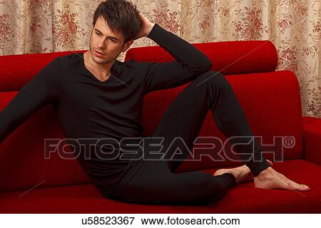Stock Photo - Man in black long underwear. Fotosearch