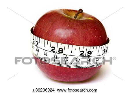 Measuring an apple View Large Photo Image Picture - Measuring an apple . Fotosearch