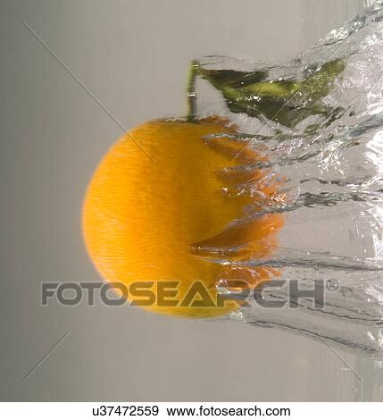 Orange in water View Large Photo Image Stock Photo - Orange in water. Fotosearch