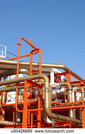 Stock Photo - Orange white and gold pipes. Fotosearch
