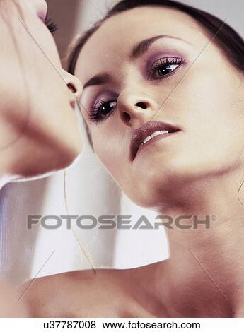 Stock Photo - Reflection of a woman . Fotosearch