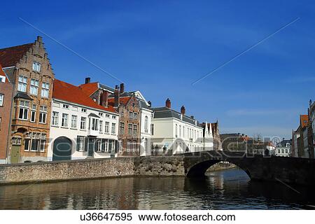 Stock Photography - River with a bridge in a city. Fotosearch