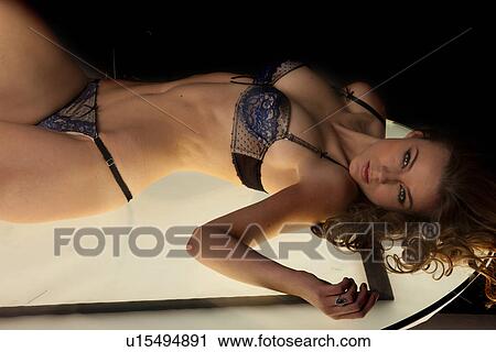 Sexy woman laying in underwear View Large Photo Image Stock Image - Sexy woman laying in underwear. Fotosearch