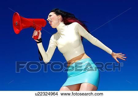 Picture - Side view of a woman with a megaphone . Fotosearch