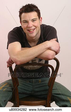 Stock Image - Sitting on a chair . Fotosearch