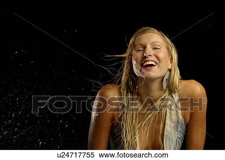 Smiling wet woman in a studio View Large Photo Image Stock Photography - Smiling wet woman in a studio . Fotosearch