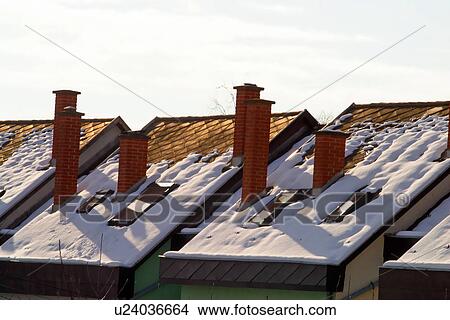 Picture - Snow covered roof tops. Fotosearch