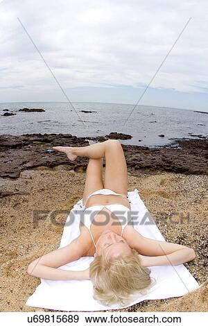 Stock Photo - Sunbathing . Fotosearch