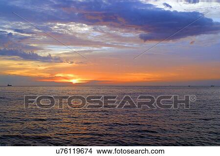 Sunset on the water View Large Photo Image Picture - Sunset on the water. Fotosearch