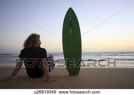 Stock Photo - Surfer at sunset . Fotosearch