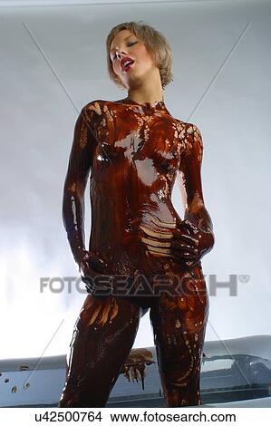 Woman covered in chocolate View Large Photo Image Picture - Woman covered in chocolate . Fotosearch