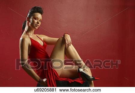 Stock Image - Woman in a red dress . Fotosearch
