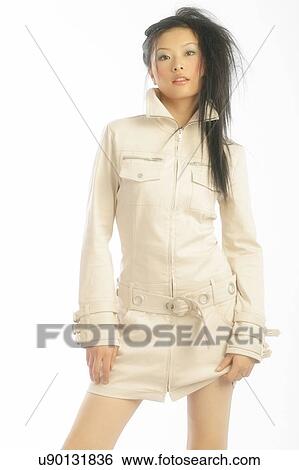 Stock Photograph - Woman in a trench coat . Fotosearch
