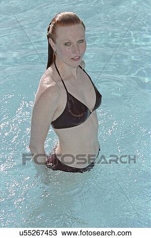 Stock Image - Woman in swimming pool . Fotosearch