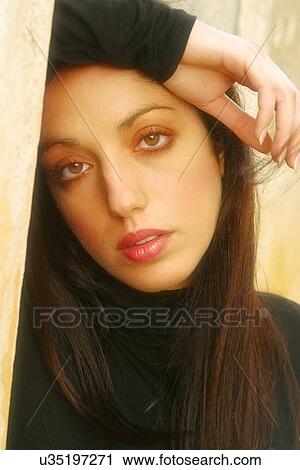 Stock Image - Woman leaning on her arm . Fotosearch