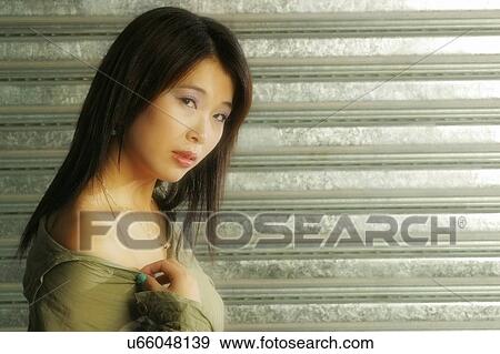 Stock Photo - Woman looking at camera . Fotosearch
