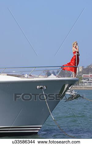 Picture - Woman on a yacht . Fotosearch