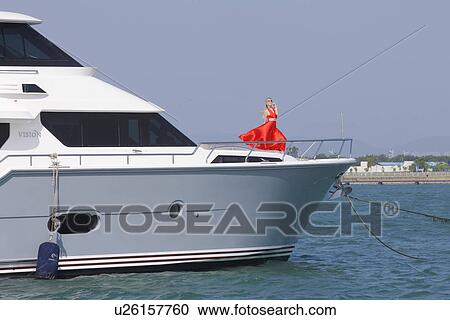 Woman on a yacht View Large Photo Image Stock Image - Woman on a yacht . Fotosearch