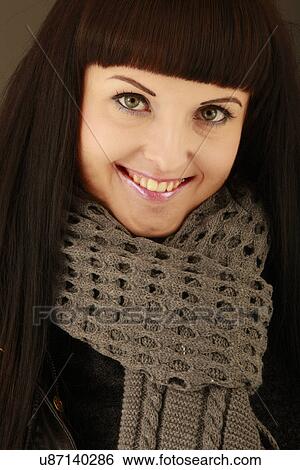 Stock Photograph - Woman wearing a scarf . Fotosearch