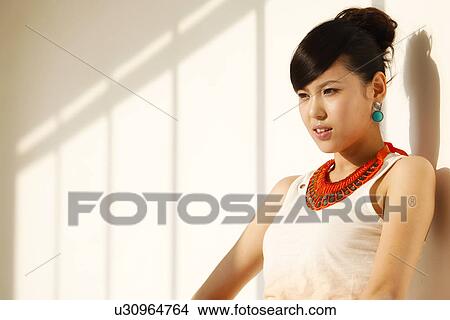 Picture - Woman with a large necklace on . Fotosearch