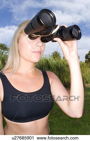 Woman with binoculars View Large Photo Image Stock Image - Woman with binoculars . Fotosearch