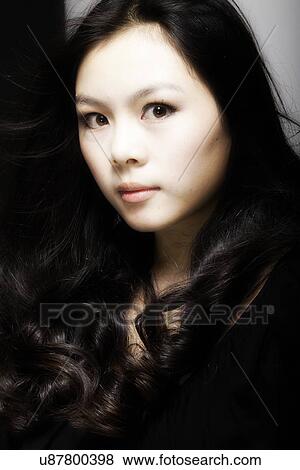 Woman with long black curly hair View Large Photo Image Stock Photo - Woman with long black curly hair . Fotosearch