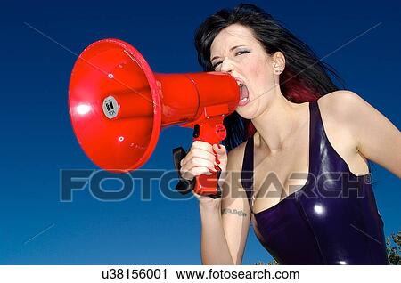 Woman yelling in a megaphone View Large Photo Image Stock Image - Woman yelling in a megaphone . Fotosearch
