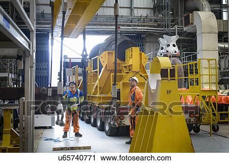Banksman and crane operator lowering crane to turbine hall during power station outage View Large Photo Image Stock Image - Banksman and crane operator lowering crane to turbine hall during power station outage. Fotosearch