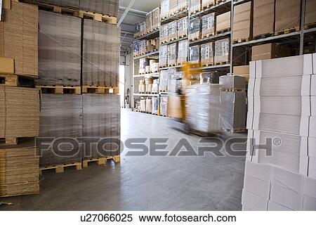 Blurred forklift truck in storage warehouse View Large Photo Image Stock Photography - Blurred forklift truck in storage warehouse. Fotosearch