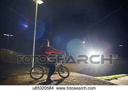 BMX-cyclist riding at night time View Large Photo Image Picture - BMX-cyclist riding at night time. Fotosearch