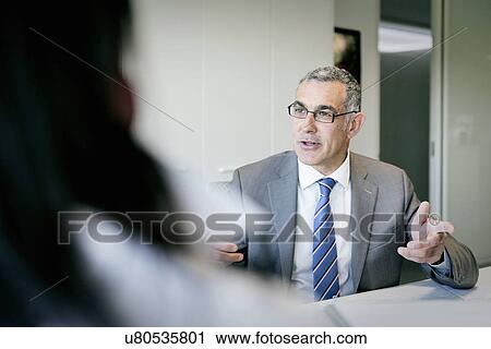 Businessman and woman in discussion View Large Photo Image Stock Image - Businessman and woman in discussion. Fotosearch