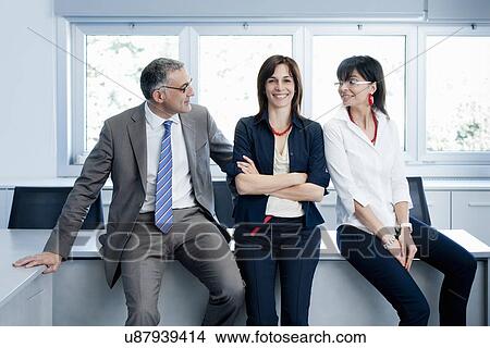 Businessman and women taking break View Large Photo Image Picture - Businessman and women taking break. Fotosearch