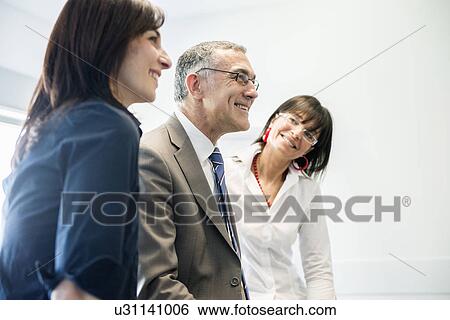 Businessman and women taking break View Large Photo Image Stock Photograph - Businessman and women taking break. Fotosearch
