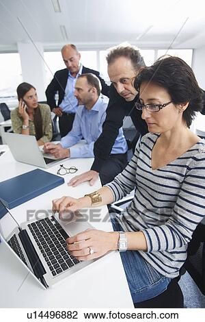 Businesspeople in brainstorming meeting View Large Photo Image Stock Image - Businesspeople in brainstorming meeting. Fotosearch