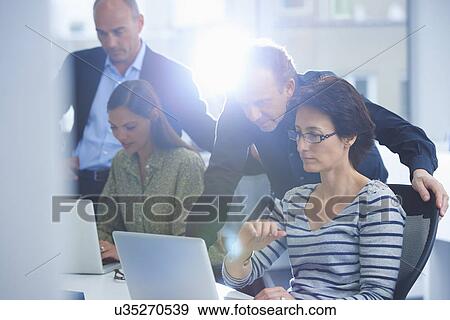 Businesspeople in brainstorming meeting View Large Photo Image Stock Photo - Businesspeople in brainstorming meeting. Fotosearch